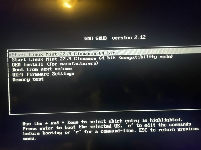 Phone photo: the first boot menu, still saying Linux Mint